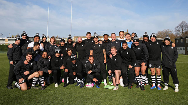 Barbarians players and coaching staff pose for a team picture