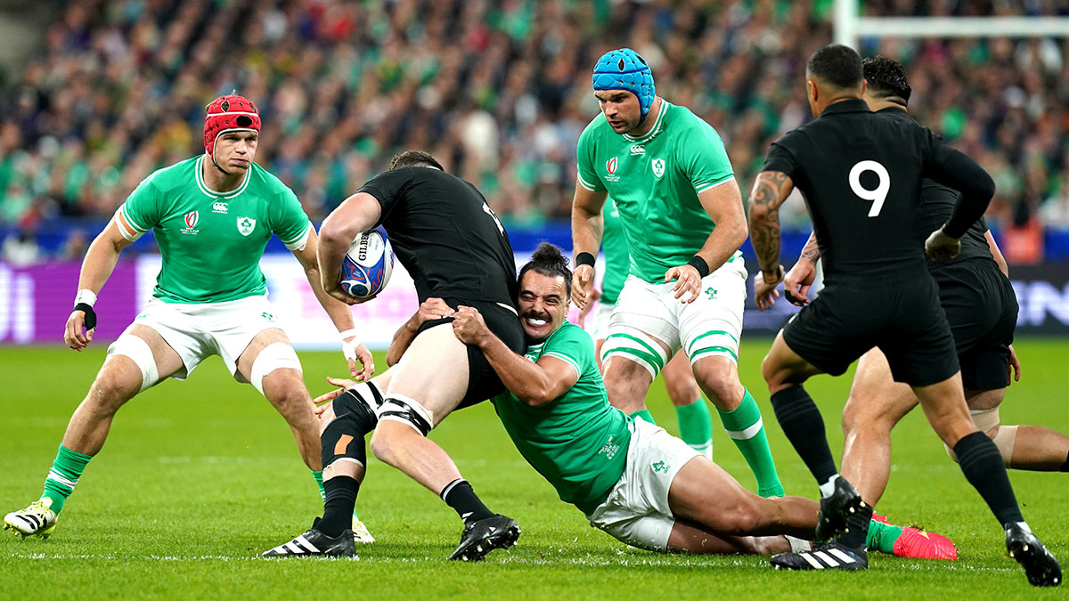 Brodie Retallick is tackled by James Lowe during Ireland v New Zealand quarter final at 2023 Rugby World Cup