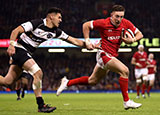 Josh Adams goes through to score a try for Wales v Barbarians